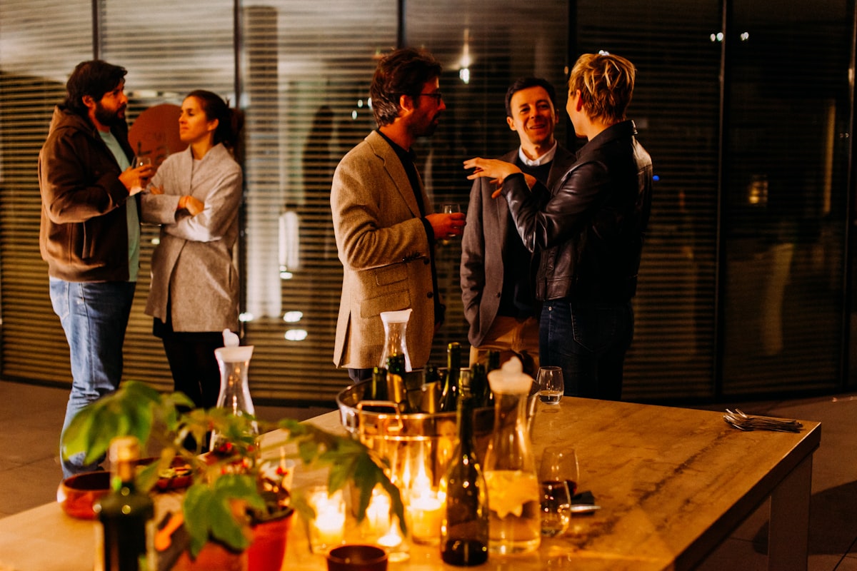 Professionals networking at an evening event